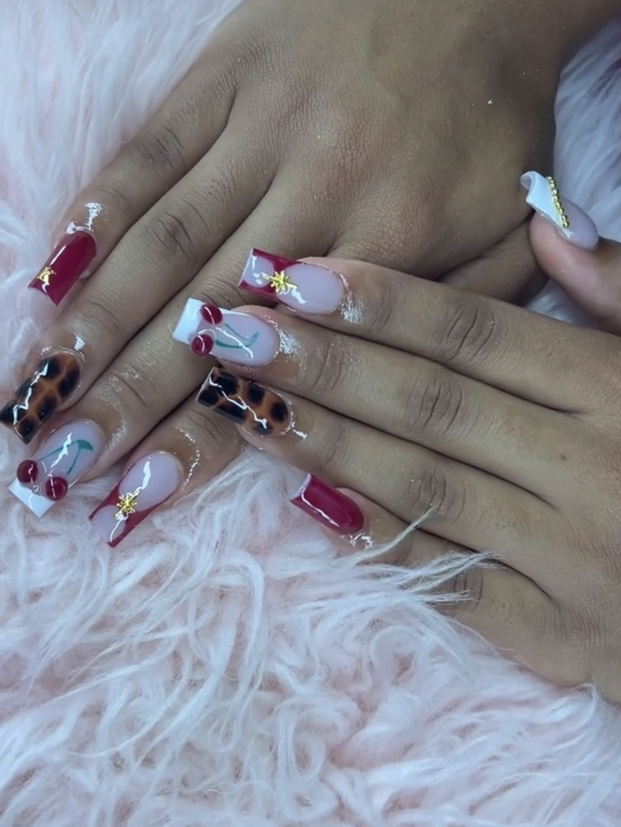 Red coffin nails with tortoiseshell, cherry detail and gold charms