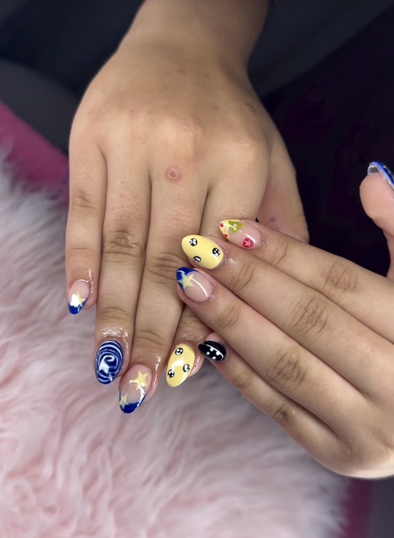 Kawaii character nail art with mixed designs