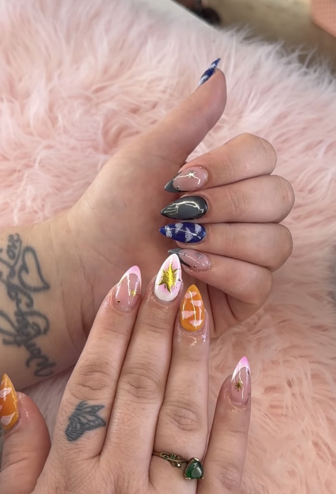 Brown leopard print coffin nails with gold charm accents